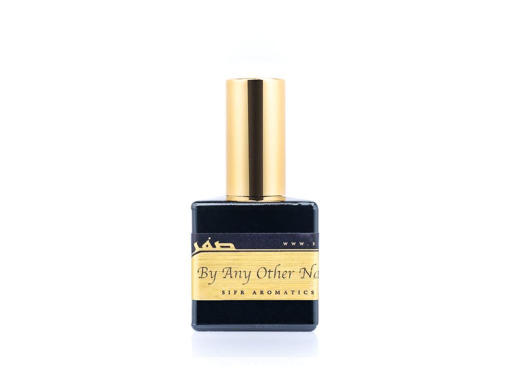 50ml spray bottle of Eau De Parfum placed elegantly on a white background. The bottle is sleek and black, with a polished gold cap. The label on the bottle is designed in gold and black, featuring Sifr Aromatics' logo and the perfume name 'By Any Other Name' The overall aesthetic is clean and sophisticated, highlighting the high-quality craftsmanship of the product