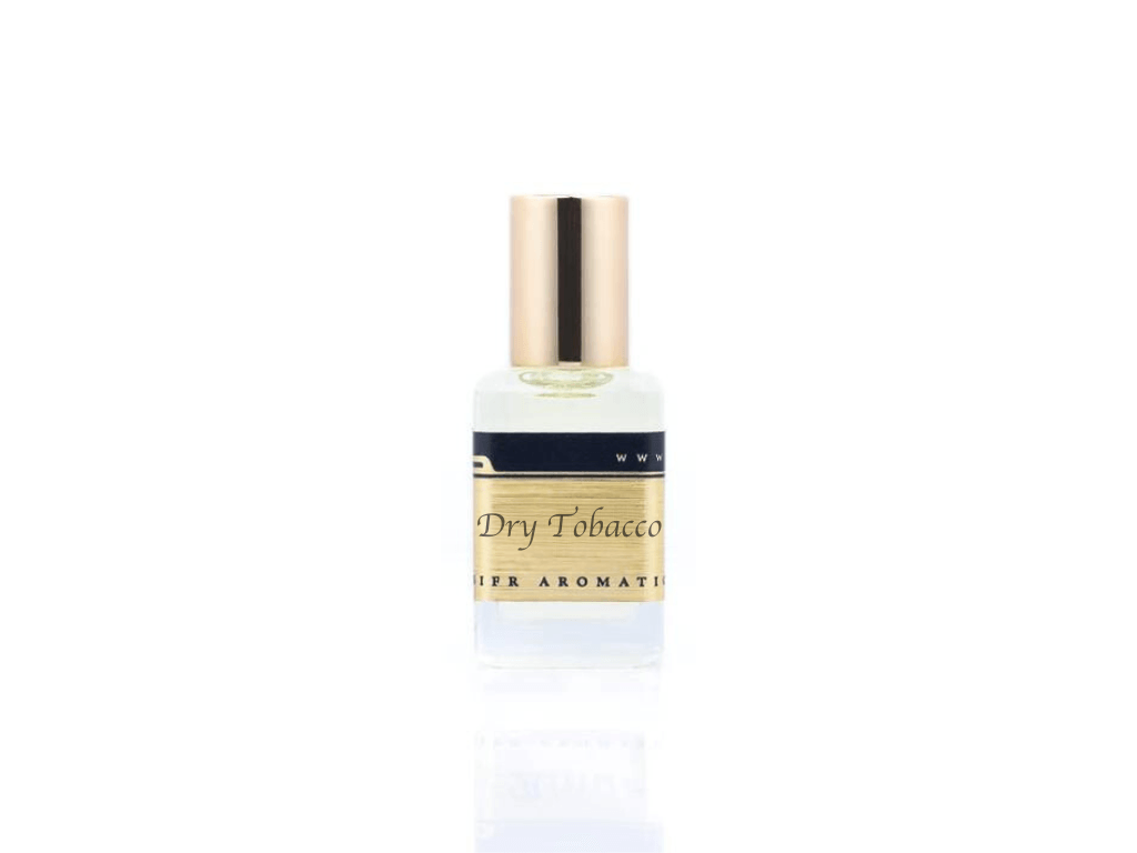 15ml roller ball oil perfume bottle placed elegantly on a white background. The bottle is sleek and cylindrical, with a smooth glass body and a polished metal roller ball at the top. The label on the bottle is designed in gold and black, featuring Sifr Aromatics' logo and the perfume name 'Dry Tobacco.' The overall aesthetic is clean and sophisticated, highlighting the high-quality craftsmanship of the product